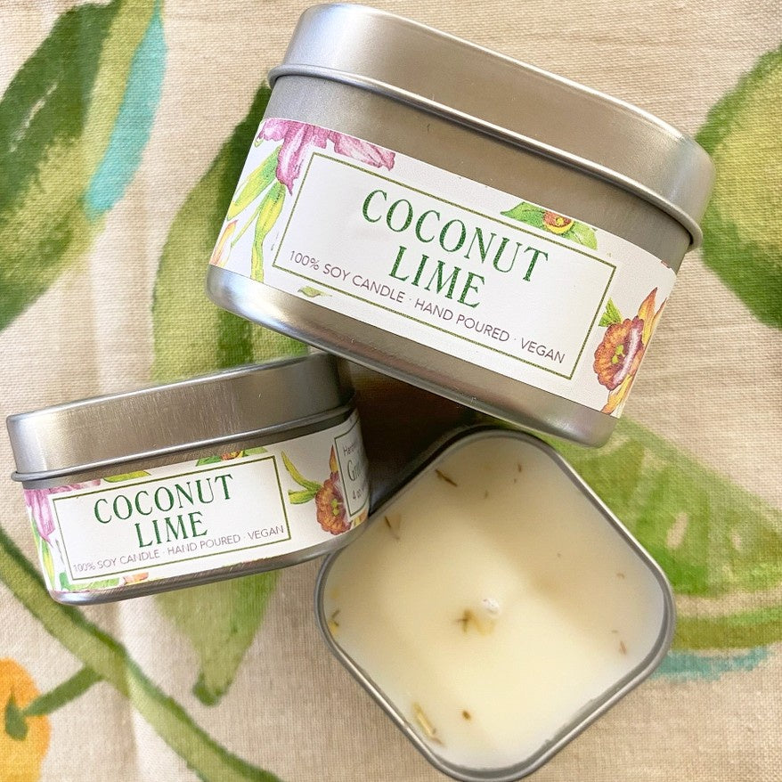 Vegan coconut lime scented candle in a tin with a floral label
