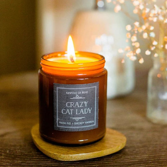 crazy cat lady candle with flame lit