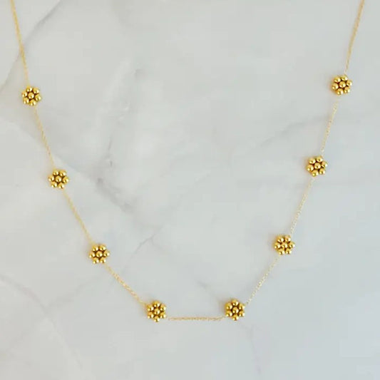 Gold necklace with small gold bead flowers