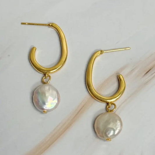 Gold hoop earrings with dangling iridescent pearl