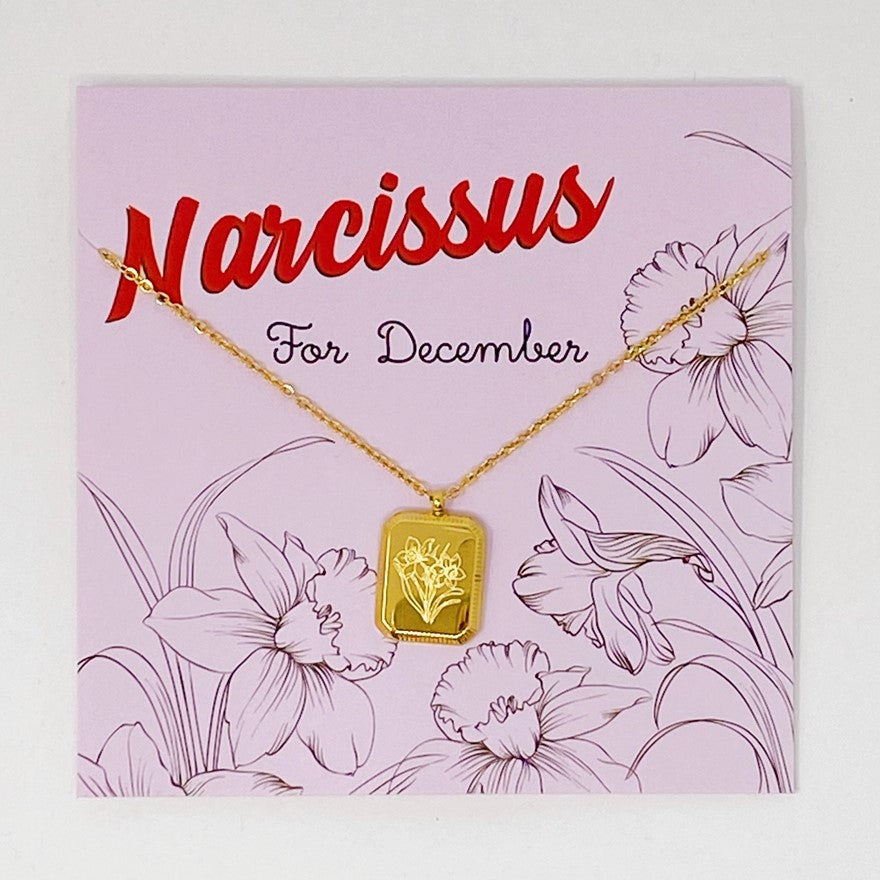 Gold plated necklace with a pendant engraved with narcissus flowers for December birthdays