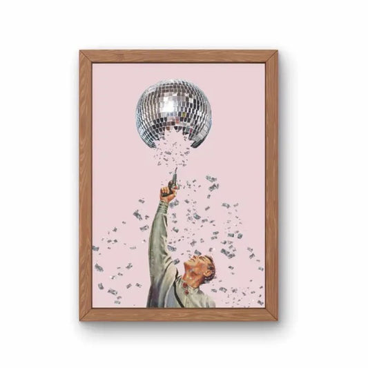 An 8x10 print of a man in a light gray shirt shooting a disco ball above his head with a pistol as fragments of the disco ball rain down around him.