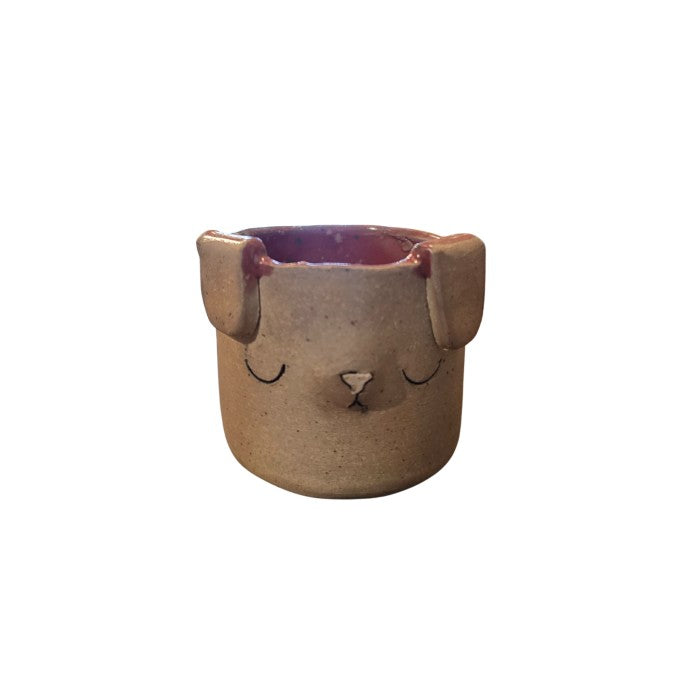 Brown ceramic cup with dog face and ears and pink interior