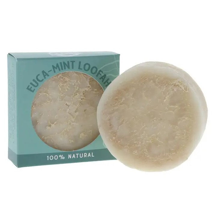 A circular bar of soap containing a natural loofah for exfoliation in the scent Euca-mint.