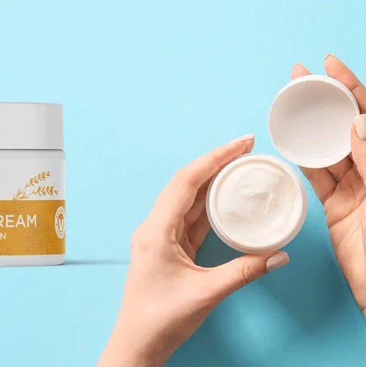 Person holding a jar of eye cream