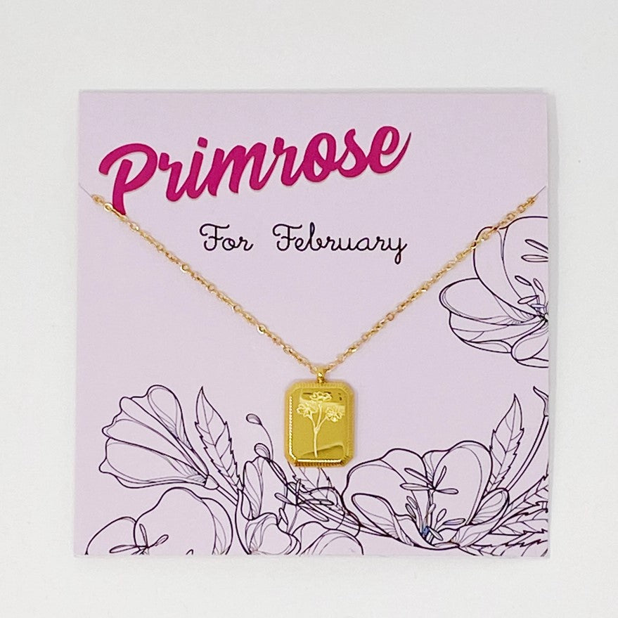 gold plated necklace with a pendant engraved with primroses for February birthdays