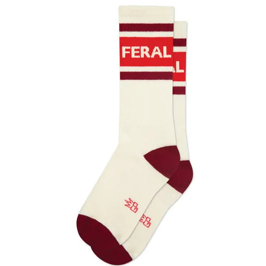 White socks with red and burgundy accents and text "Feral"