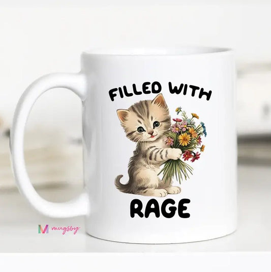 White mug with a kitten holding flowers and the text "Filled with rage"
