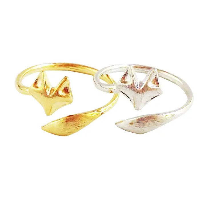 An adjustable ring available in gold or silver with a simplified fox design.