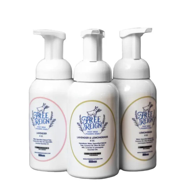 Eight ounce pump bottles of foaming goat milk hand soap in the scents lavender, lavender & lemongrass, and lemongrass.