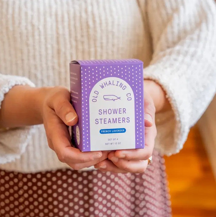 Person holding a box of four French Lavender scented shower steamers