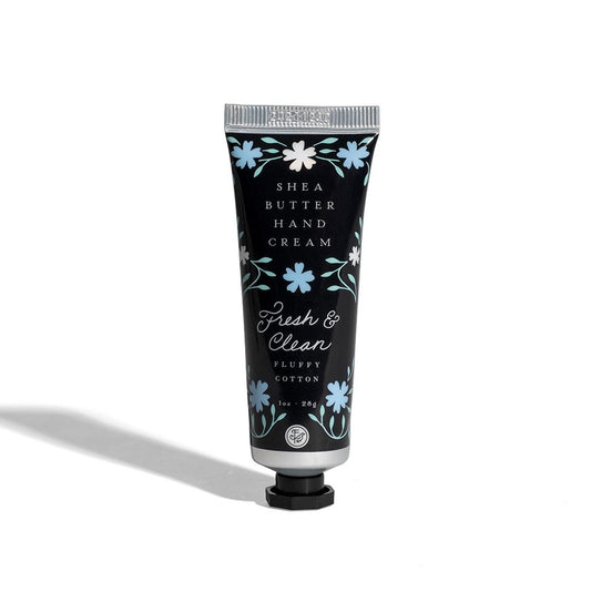 fresh and clean shea butter hand cream tube with black background and blue florals