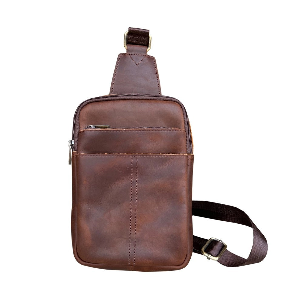 Brown leather slight bag with an adjustable strap
