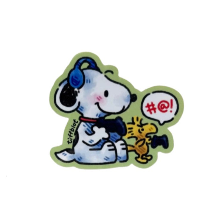 A sticker of Snoopy and Woodstock playing video games together