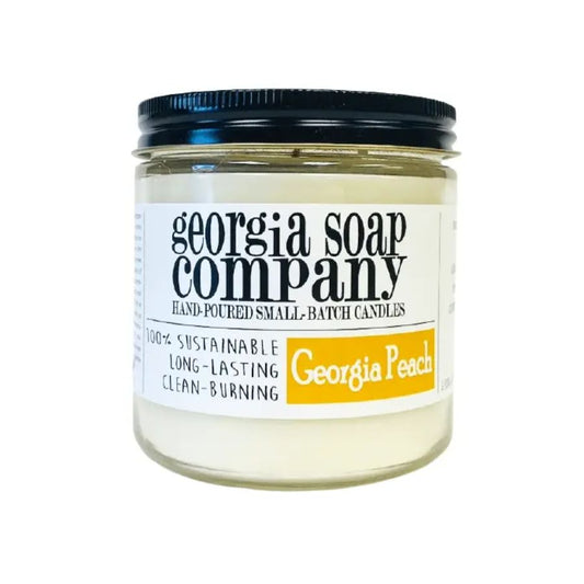 A glass jar candle from Georgia Soap Company in the scent "Georgia Peach"