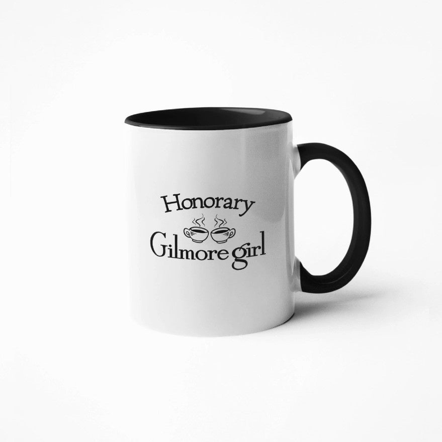 White mug with text "Honorary Gilmore girl" and coffee mug graphic