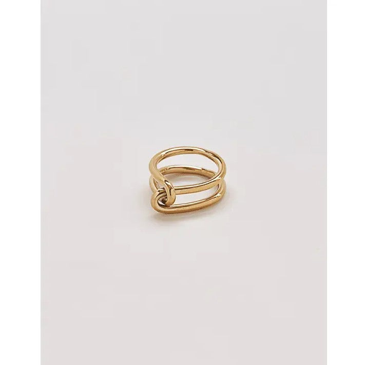 A simple gold ring with an interlocking knot design.