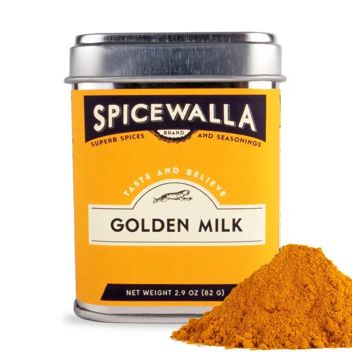 Spicewalla Golden Milk spice can with a small pile of spice on a white background