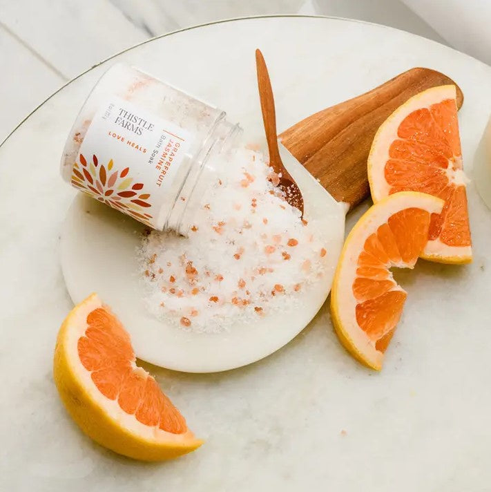 A jar of grapefruit jasmine scented bath soak.