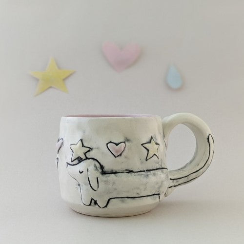 Handmade dog mug with alternating hearts and stars