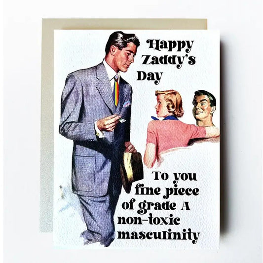 Card depicting a man in a suit with a pride flag tie and a man and woman gazing lustfully at him with text "Happy Zaddy's Day to you fine piece of grade A non-toxic masculinity"