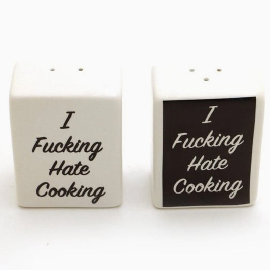 Ceramic salt and pepper shakers with text "I fucking hate cooking"