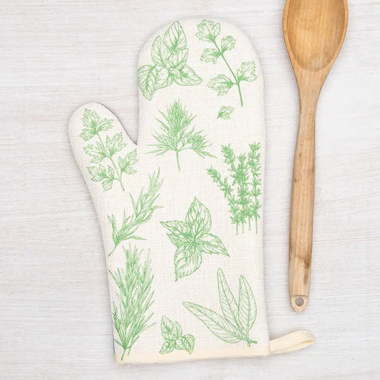 White right hand oven mitt with green herb pattern