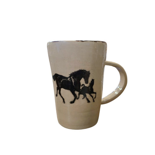 White ceramic mug with a black image of two horses running on it
