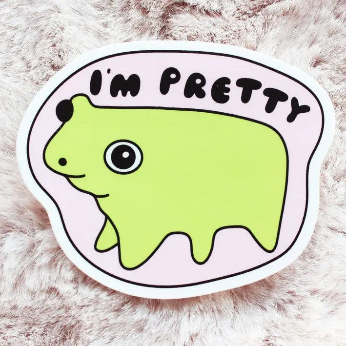A sticker featuring a lumpy cartoon frog on a light pink background with text "I'm Pretty"