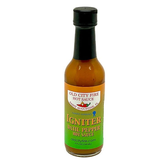 Five fluid ounce bottle of Datil Pepper Hot Sauce with a green and orange label