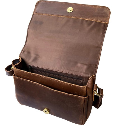 Inside compartments of dark brown leather bag