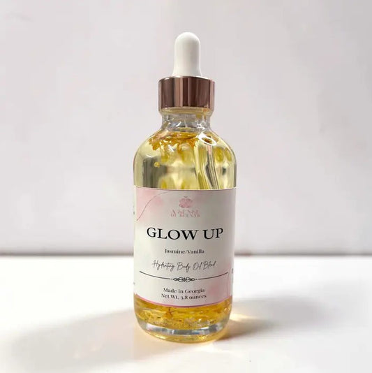 A glass bottle of jasmine and vanilla scented body oil with a dropper