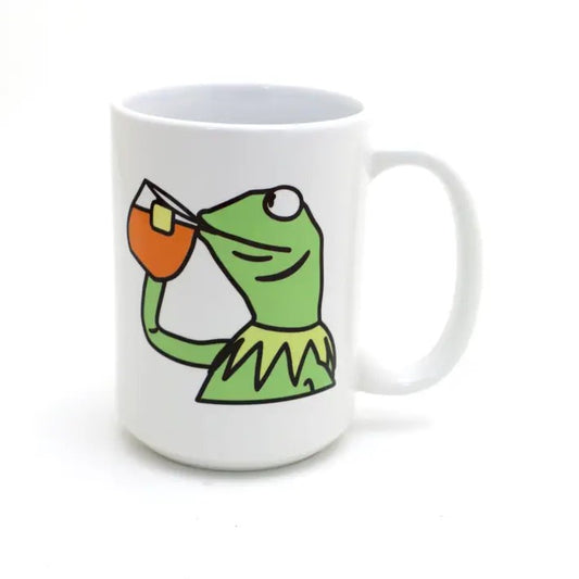 White mug featuring an illustration of Kermit the frog sipping tea