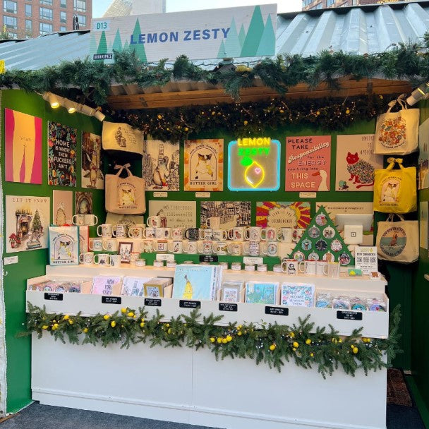 Artist Monica of Lemon Zesty and her display at an art market in New York City