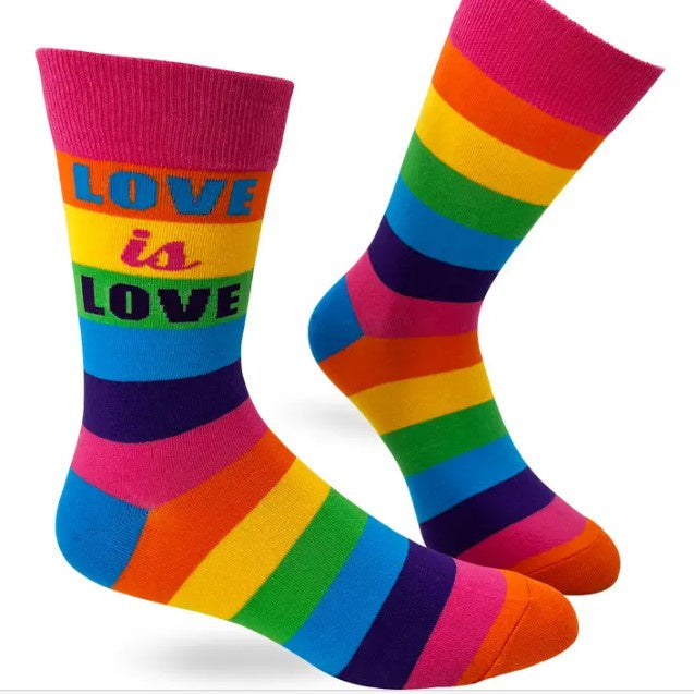 Bright rainbow calf socks that read "Love is Love."