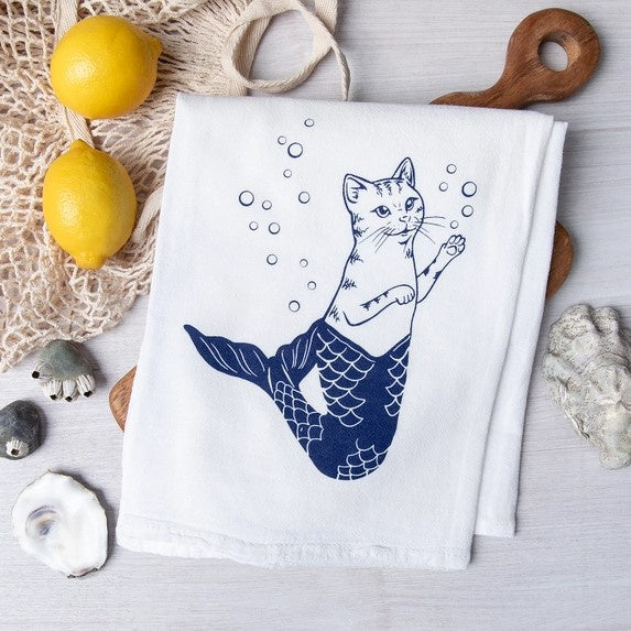 A tea towel featuring a smiling cat mermaid with bubbles drifting around it.