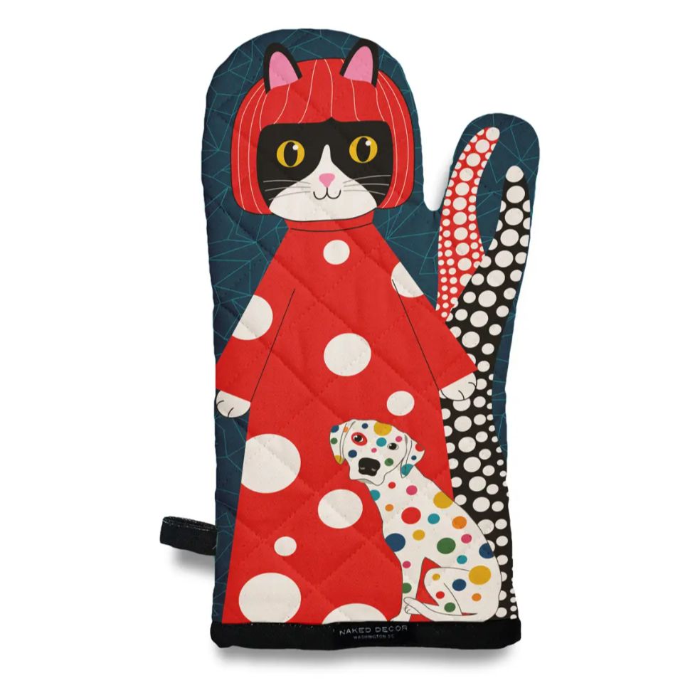 Oven mitt featuring a design of a smiling cat wearing a polka dotted dress, standing behind a polka dotted dog