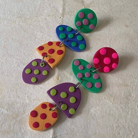Handmade polymer clay earrings with polka dots by artist karla beneitez