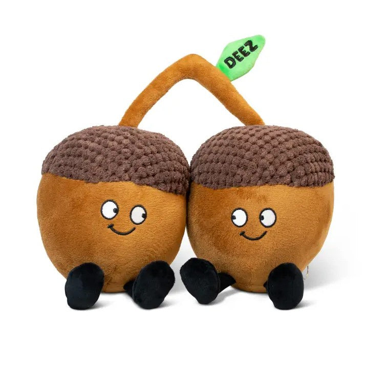 Plushie shaped like a pair of smiling acorns with a leaf that reads "Deez"
