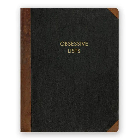 Black journal with brown accents and the words "Obsessive Lists" embossed in gold lettering on the front.