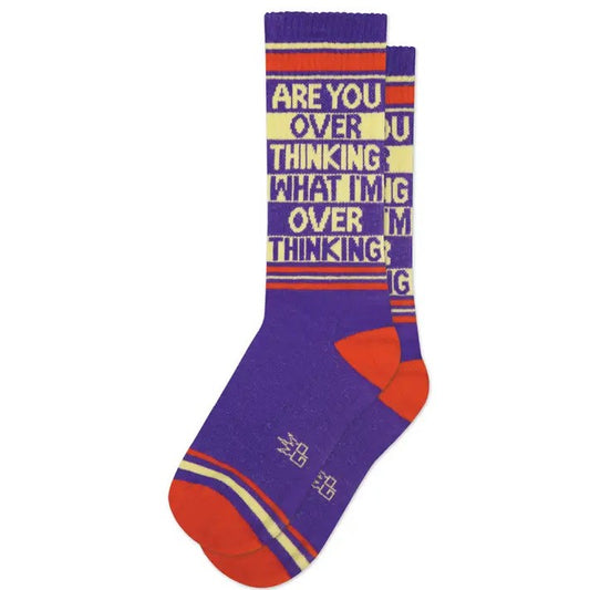 Purple socks with white and red accents and text "Are you overthinking what I'm overthinking"