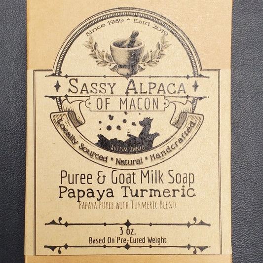 A three ounce bar of papaya turmeric scented goat milk soap 