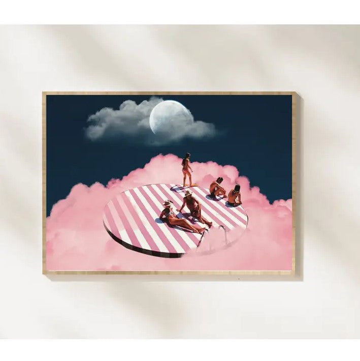 An 8x10 surrealist print of several people in swimsuits lounging on a striped pink and white platform floating on a pink cloud.