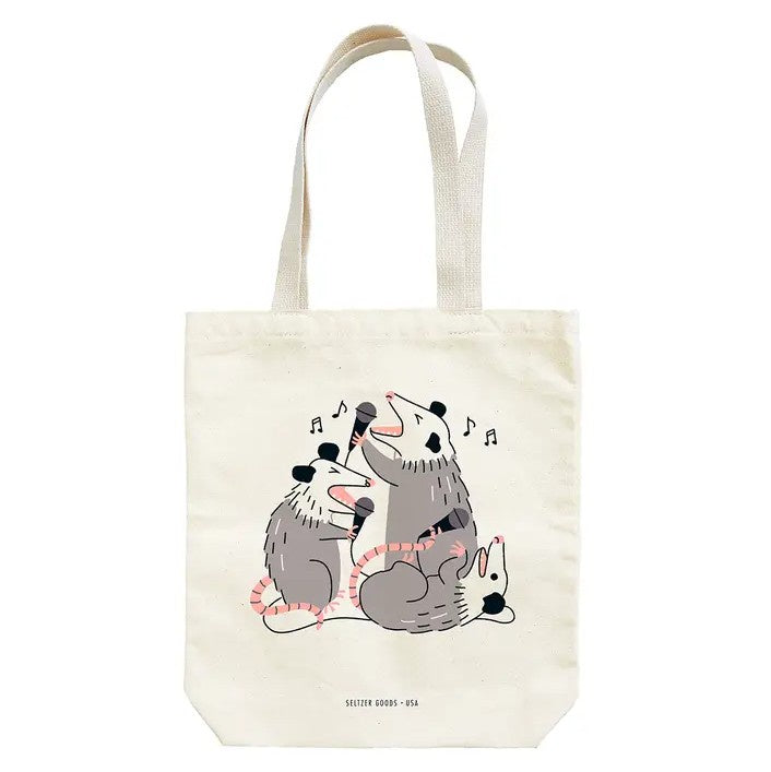 Tote bag with a graphic of three possums singing karaoke