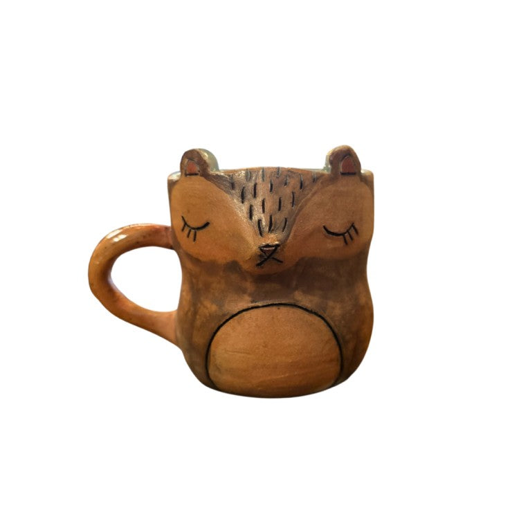Brown ceramic mug with a possum face
