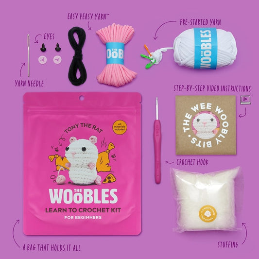 Contents of Woobles crochet kit including yarn, needle, stuffing and eyes