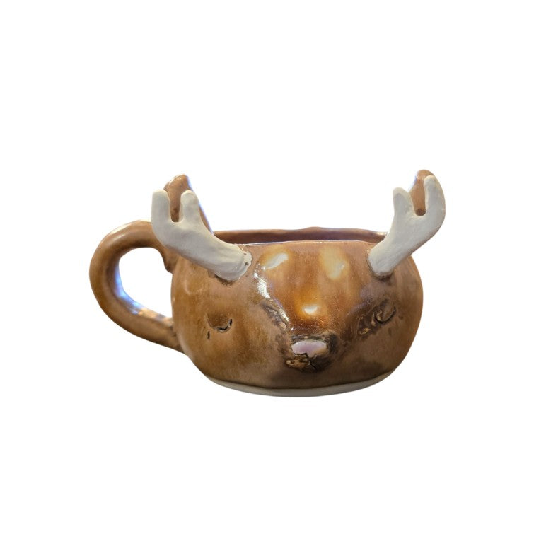 Ceramic mug shaped like reindeer face with a pink nose and white antlers