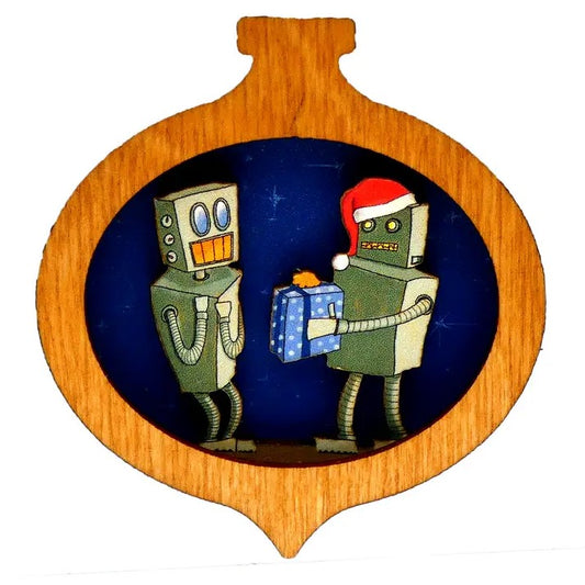 Small wooden Christmas ornament featuring a robot in a Santa hat offering a wrapped gift to another excited robot