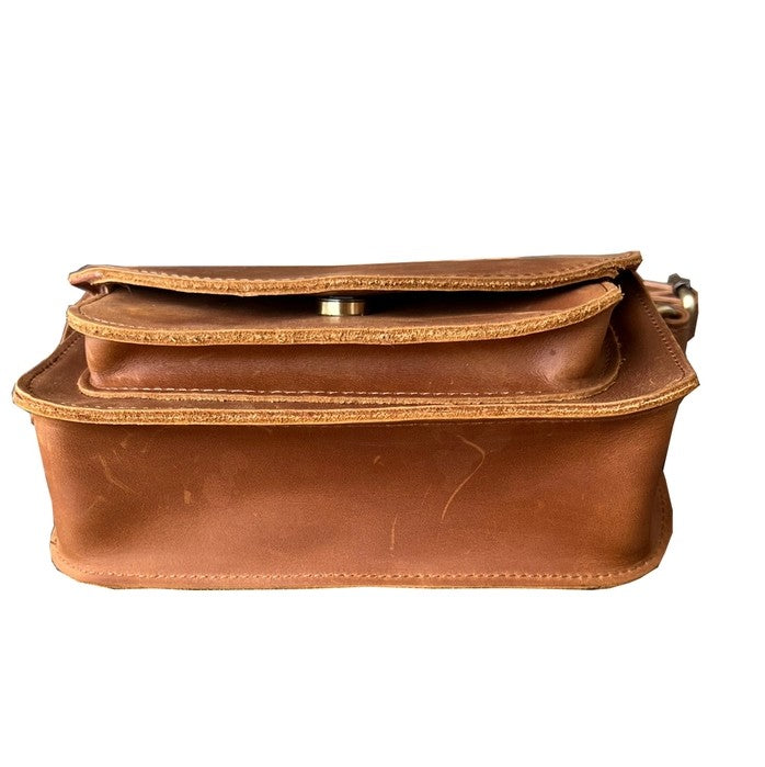 Bottom detailing on light brown leather purse