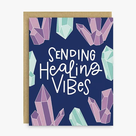 Greeting card featuring images of purple and blue crystals and text that reads "Sending healing vibes"